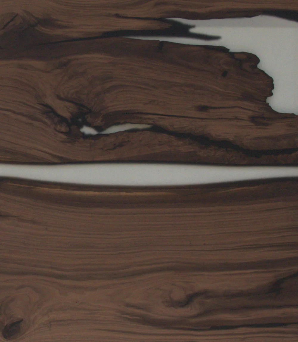 A walnut top with a clear resin river and resin-filled edges